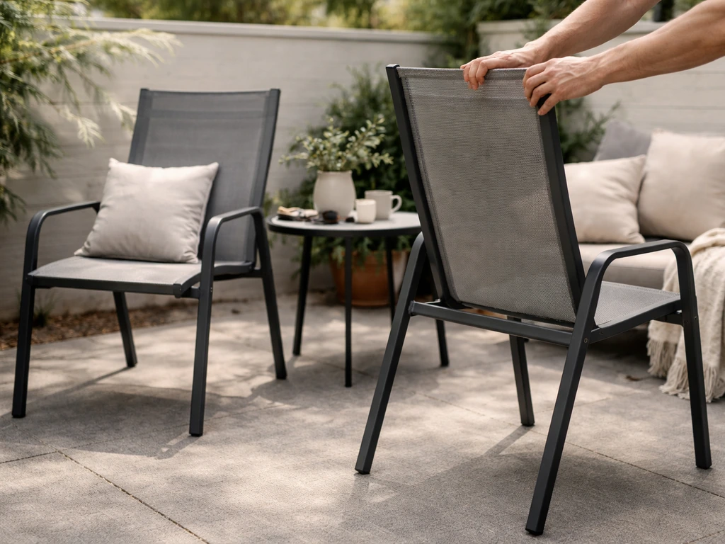 Two patio chairs rotated so their smallest sides face the wind, shown right after repositioning.